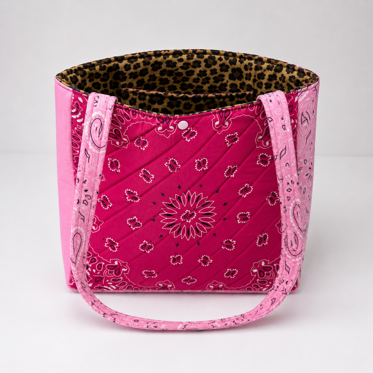 Handmade pink tote bag with cheetah print lining and inside pocket.
