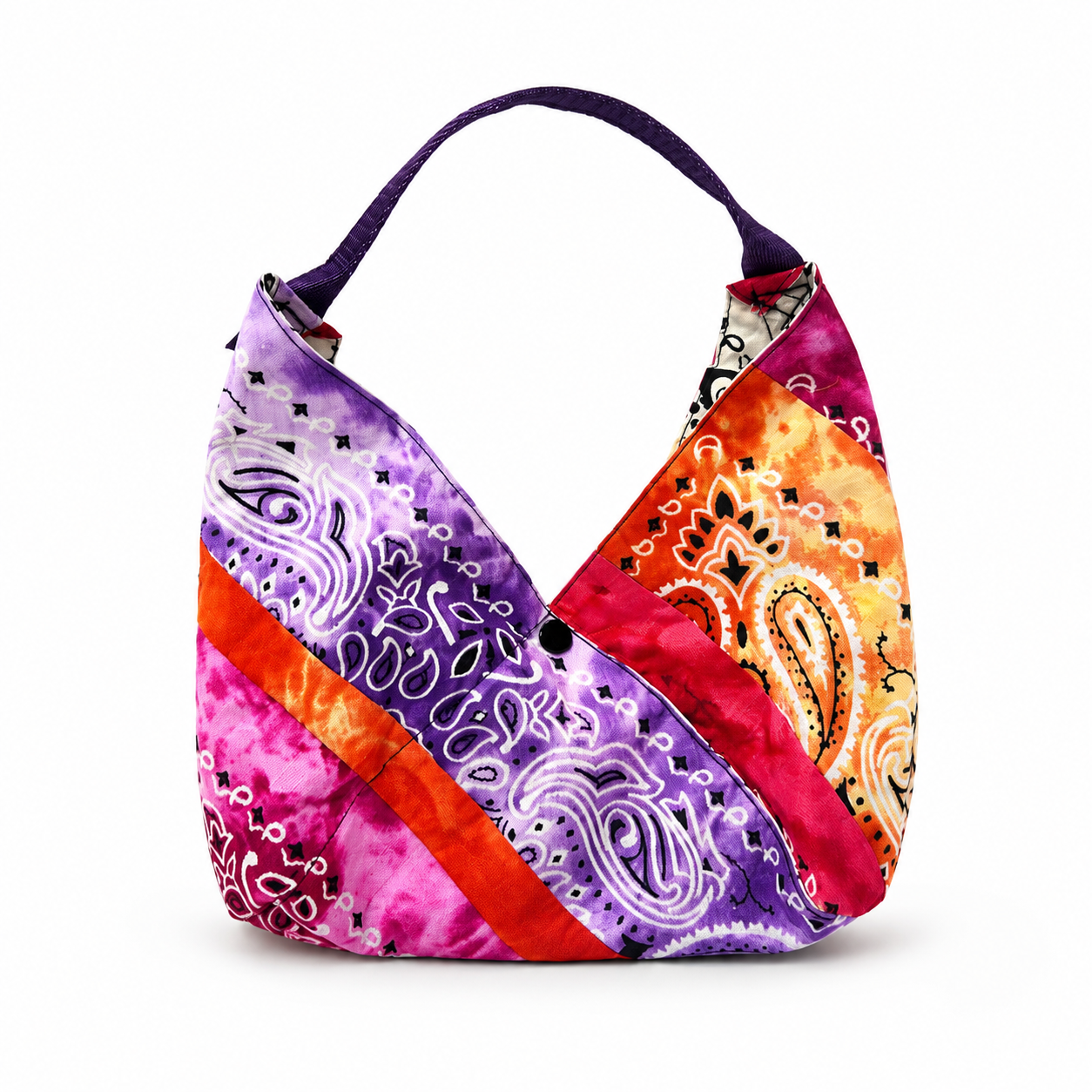 Handmade patchwork bandana hobo bag in purple, pink, red, orange, and cream fabric.